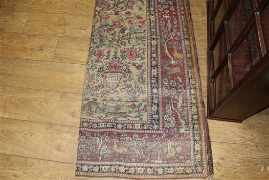 A Caucasian rug with triple medallion on a blue ground and two worn Persian rugs 210 x 120cm, 205 x 135cm and 195 x 145cm